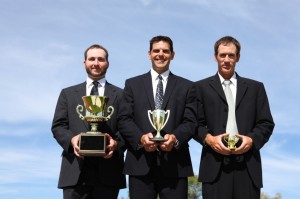 Businessmen with trophies